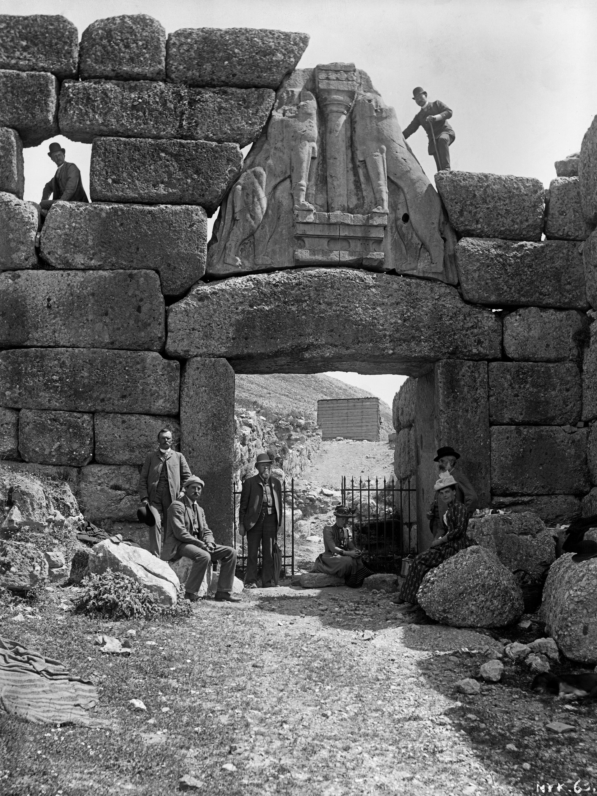 Fig. 2: Mycenae. A group of visitors, including Wilhelm and Anne Dörpfeld, at the Lions Gate. D-DAI-ATH-Mykene-0063 
